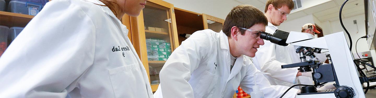 Students using microscope in Bruner Hall Lab